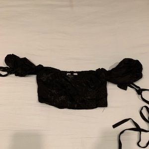 Chrissy x revolve cross body silky black wrap top with bow sleeve